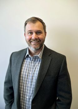 This is a professional headshot of Treyton Zary, Advisor at Traverse Analytics. With expertise in supply chain management, national security, and emergency management, Treyton provides valuable insights and research to guide the organization’s progress and innovation.